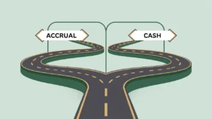 Illustration of a road splitting into accrual and cash accounting paths